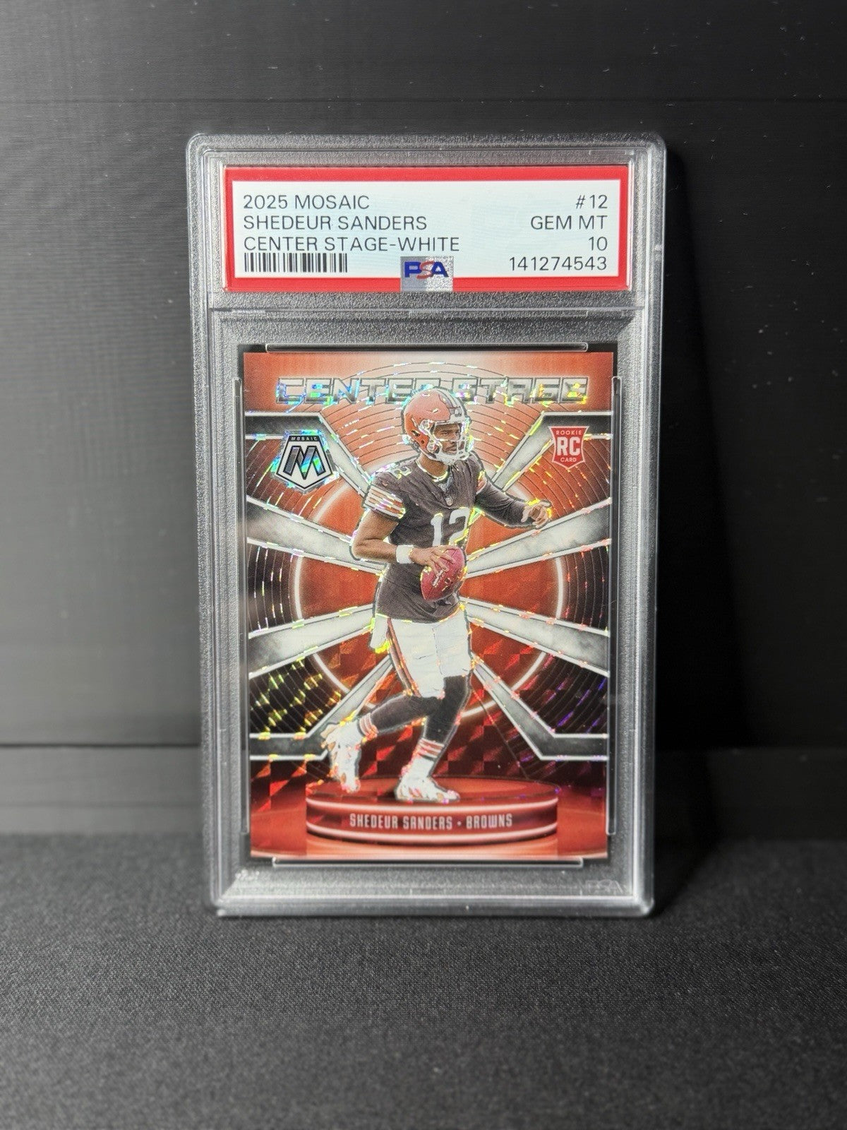 2025 Mosaic - Center Stage Mosaic Shedeur Sanders #12 White Prizm /25 (RC)0